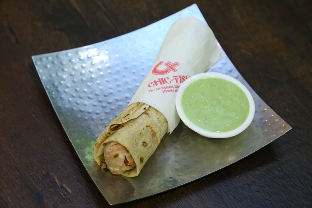 Chicken seekh roll served with mint-coriander chutney